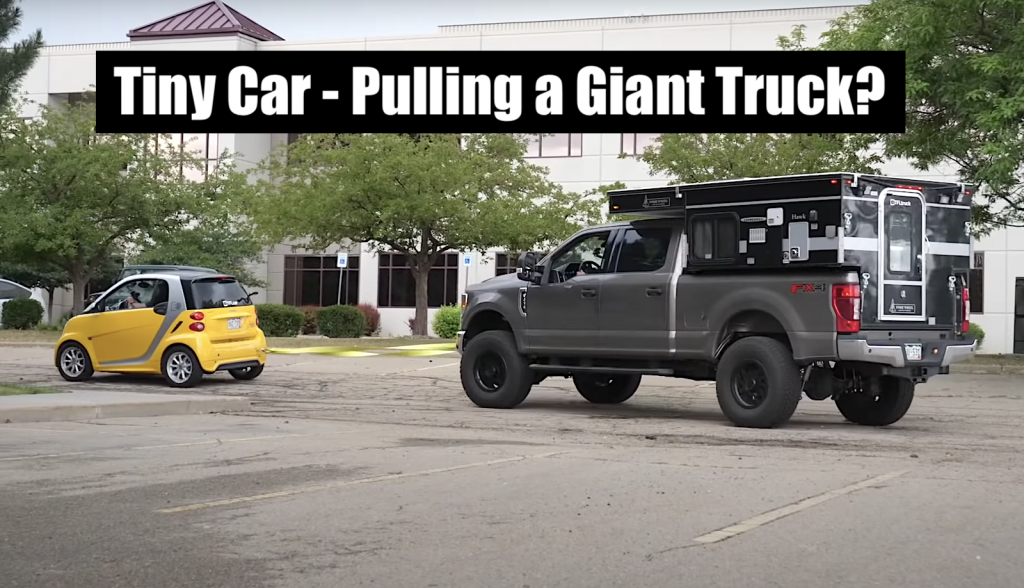 tiny electric car smart towing giant ford f-250 super duty